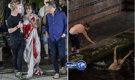 بالصور.. الإنجليز يرمون أنفسهم في القنوات المائية ويتسلقون إشارات المرور بعد الخروج من المونديال