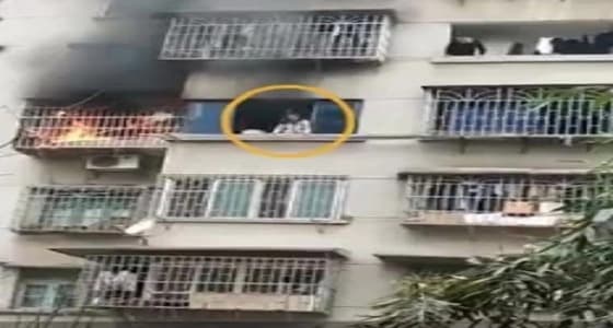 بالفيديو.. فتاة تنجو من حريق بأعجوبة